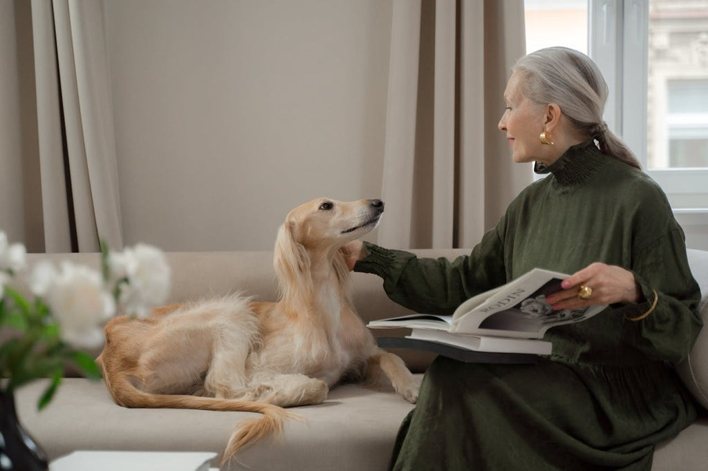 A woman caressing her dog