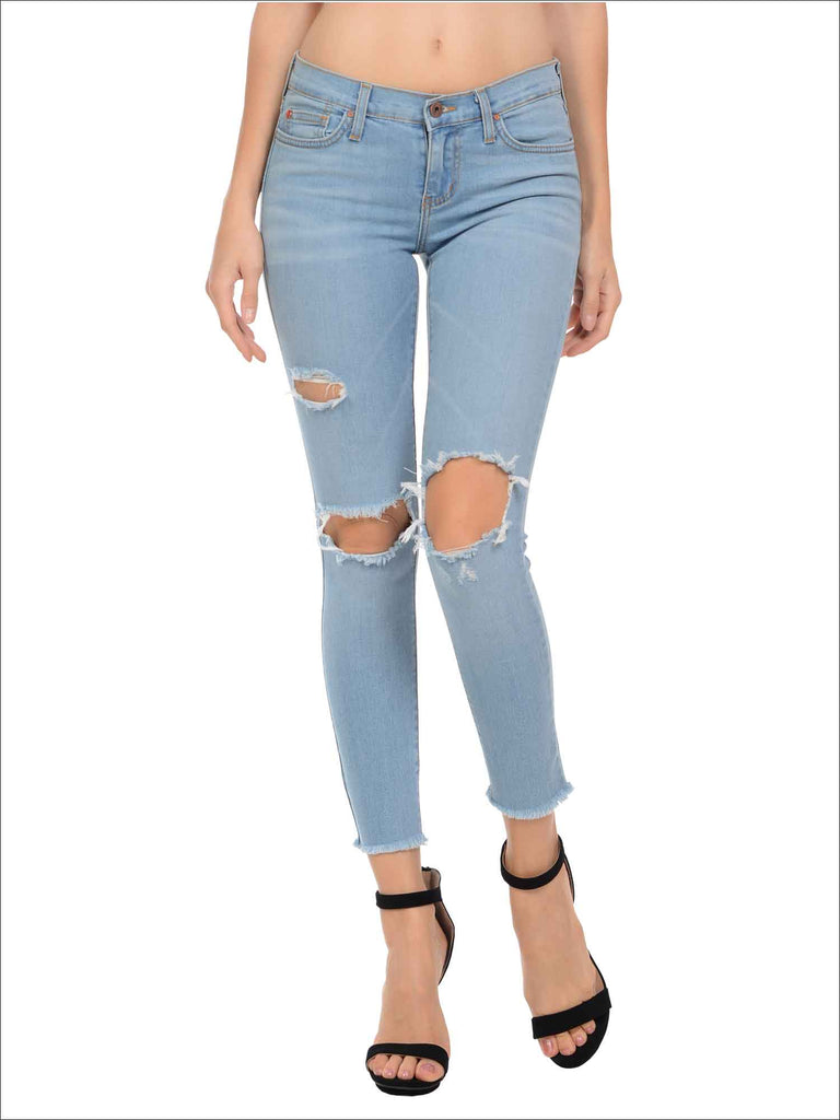 knee cut blue jeans