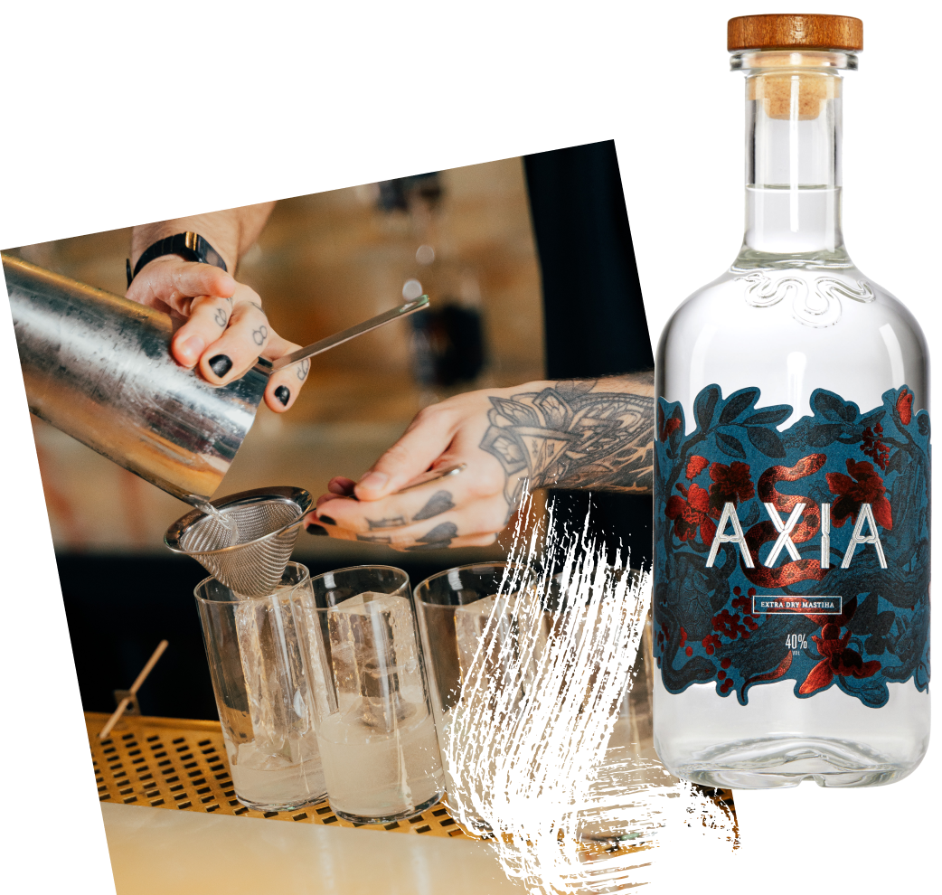 Tattooed bartender pouring cocktail next to Axia bottle.