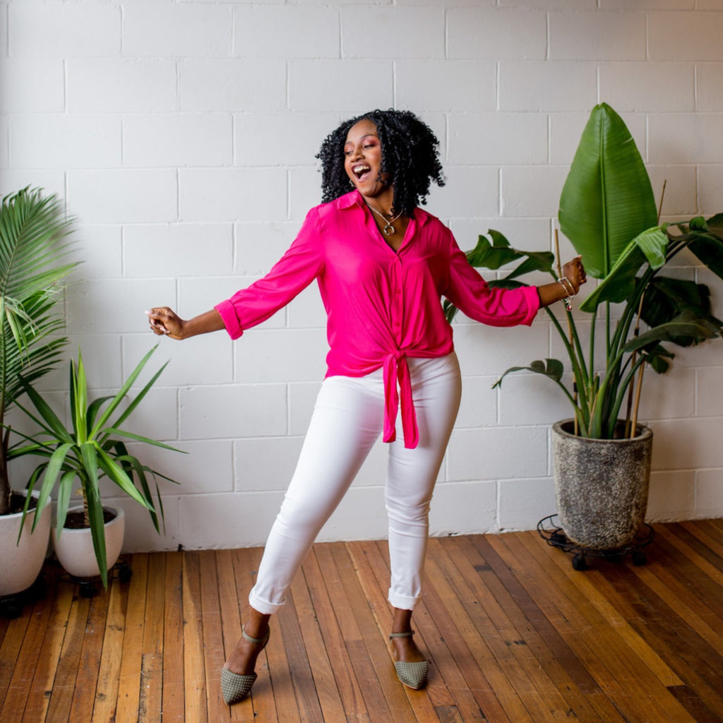 Sonia dancing in our white Margaux jeans and Raspberry Cate technical shirt 