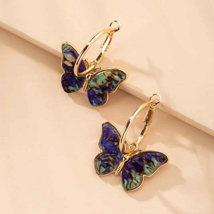 Product Image for Avelena | Vergoldete Schmetterlingsohrringe mit Acrylkristallen Mariposa, Blau