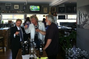 John Lodge discusses his wine with Joe Bob Hitchcock (right) and Don Sanchez of KGO-TV (left)