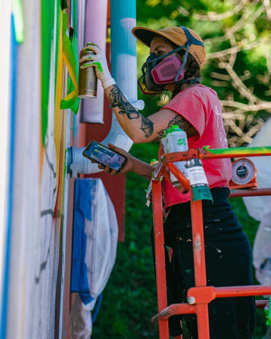 Kathryn Crawford, Kathryn Crawford muralist, Kathryn Crawford interview, artist interview, artist advice, muralist interview, muralist, female muralist, street art, North Carolina art, north Carolina Artist, North Carolina Muralist, North Carolina Street artist, spraypaint art, female street artist, painter, flower core, cottage core, flowers, skulls, spraypaint, urban culture, asheville artist, asheville murals, asheville muralist, Asheville brewing, graffiti supplies, infamy art, painter, female painters, female artists, support female artist, original art, original artist, skull art