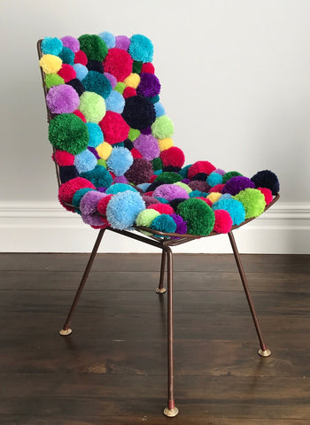 pom pom chair made by pony mctate crocheter using wool yarn