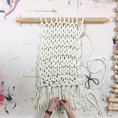 giant chunky woolen yarn blanket made in new zealand using merino sheep wool with xxl knitting needles with added tassels