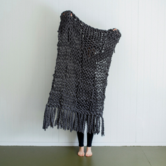 giant chunky woolen yarn blanket made in new zealand using merino sheep wool with xxl knitting needles with added tassles