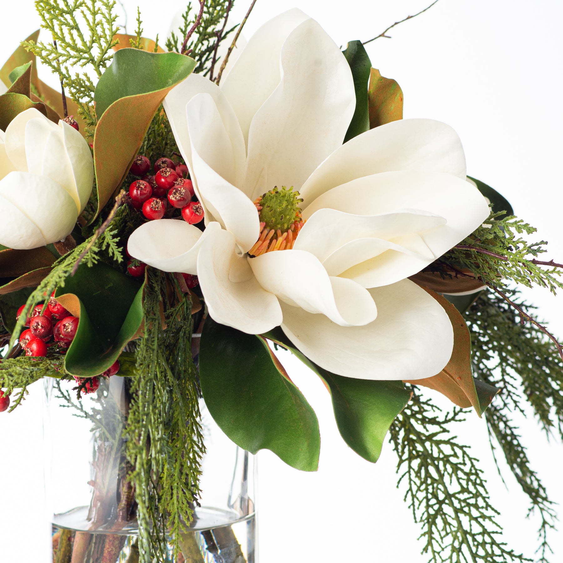 White Magnolia, Mixed Greens & Berry Everyday Winter Floral Arrangement  Centerpiece in Tapered Glass Vase