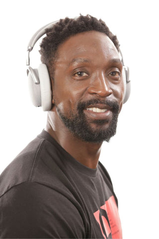 Charles Tillman using the Vital Neuro headset to showcase that neurofeedback devices can be utilized at home.