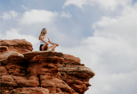 Woman using the Vital Neuro headset while meditating