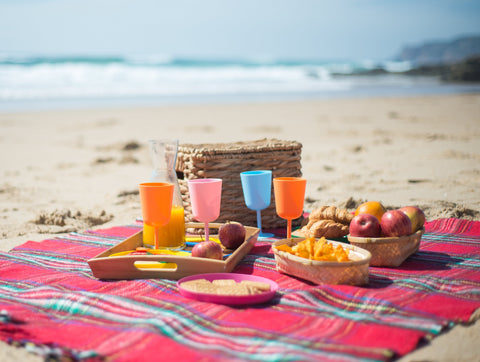 Beach picnic with fruit and snacks