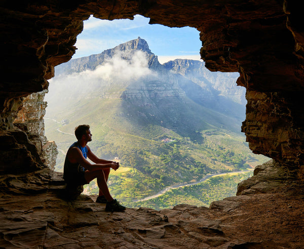 Man hiking in board shorts