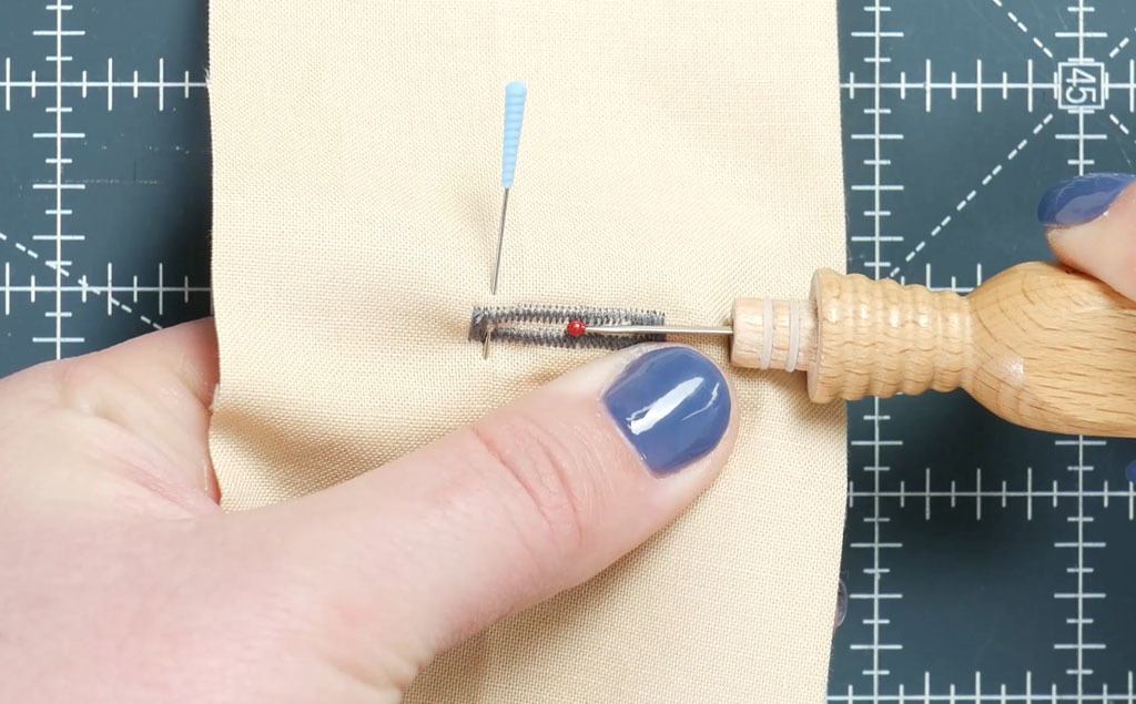 using a seam ripper to open up a buttonhole