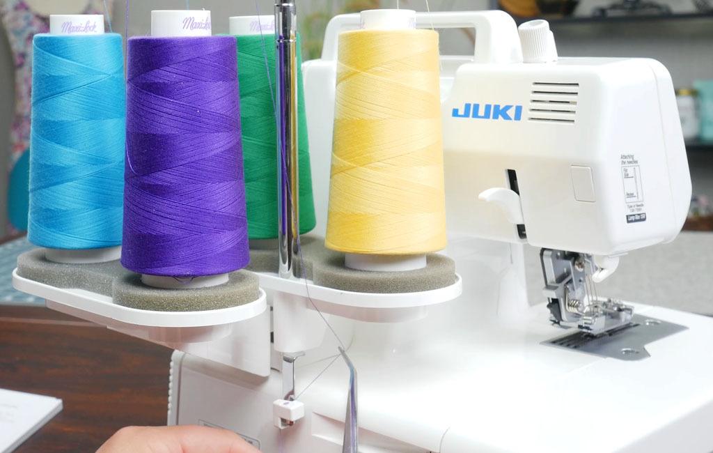 Serger thread and thread guides on the back of the MCS1500 coverstitch