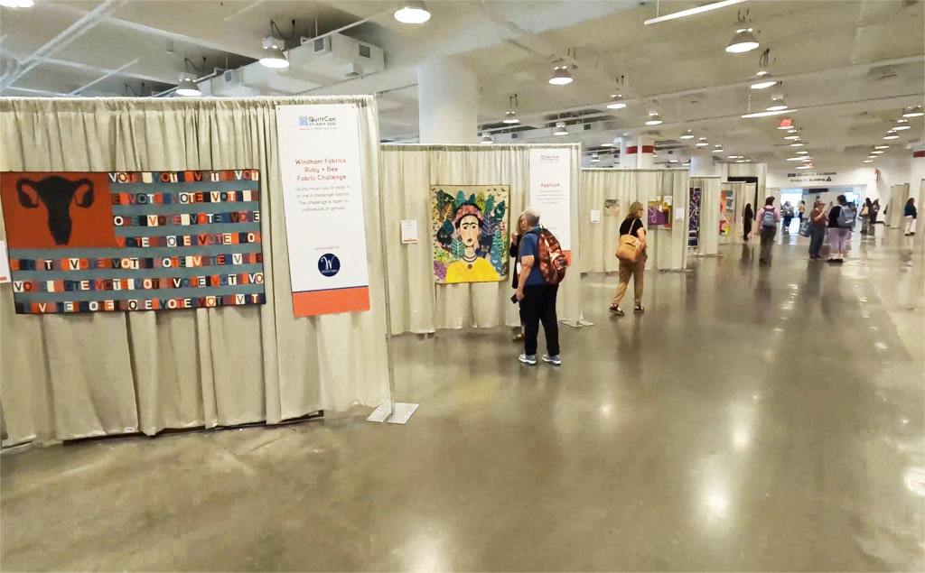 Rows of booths at QuiltCon 2023