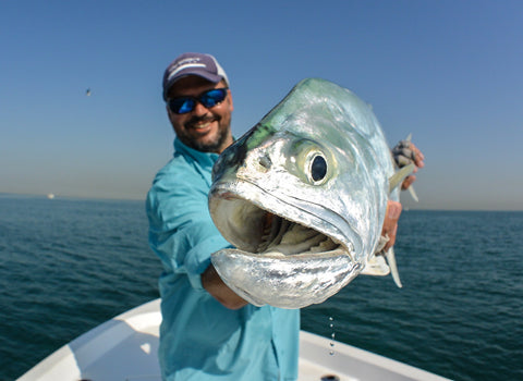 Nick Bowles T&T Ambassador holds a big queenfish caught in Dubai.