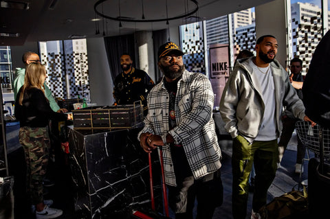 Marcus Harvey, who is usually on the road at least one day a week, at an N.B.A. All-Star Weekend event in Salt Lake City. Credit...Kim Raff for The New York Times