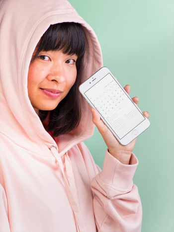 mockup-of-a-girl-showing-an-iphone-8-plus-wearing-a-pink-hoodie-22171.png__PID:ae6494bb-e089-429a-91a2-2071e77a9737