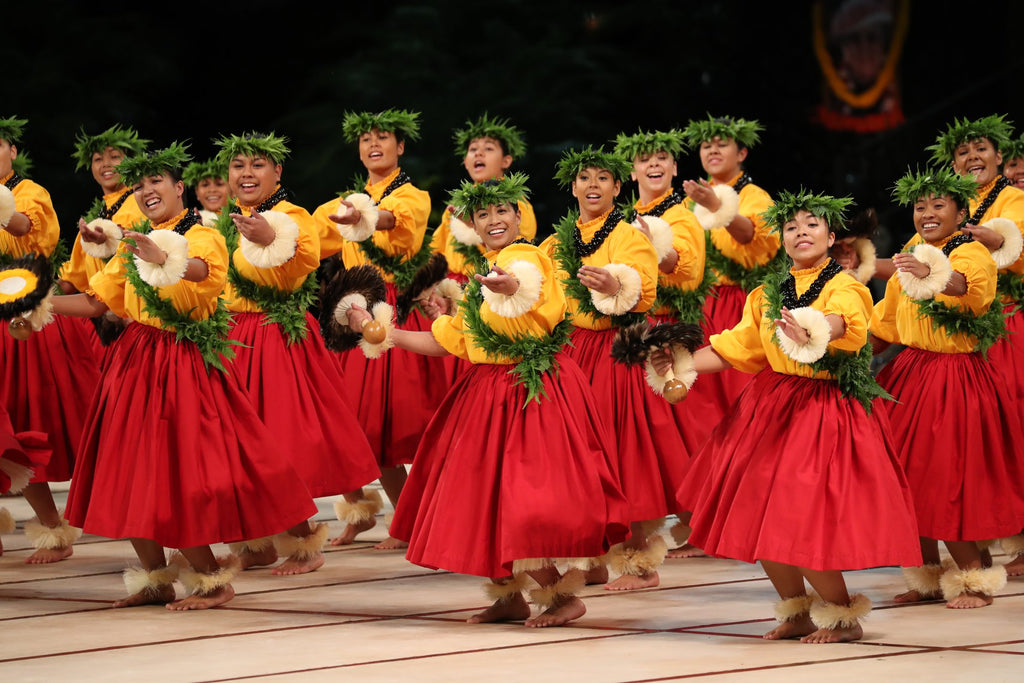 Members of Hoʻomaikaʻi Hālau Kekuaokalā‘au‘ala‘iliahi perform during the 2019 Merrie Monarch Festival. File photo/Merrie Monarch Facebook.