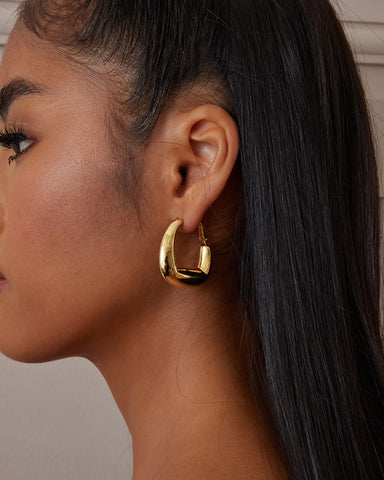 This is the product picture of chunky hoop earrings plated in gold in sterling silver material