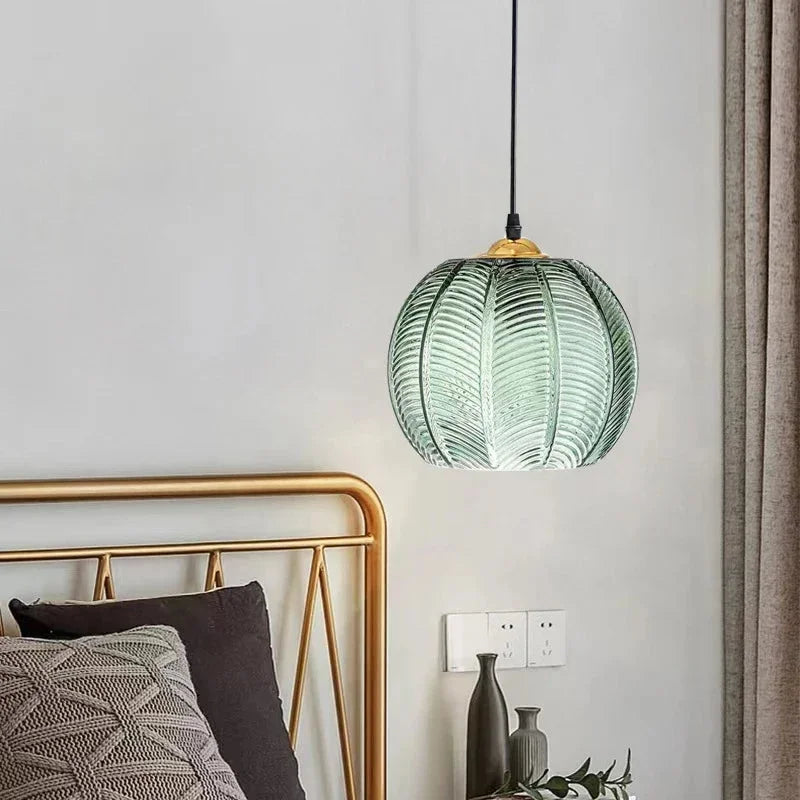 Bedside-warmth-lit-glowing-palm leaf-glass.webp__PID:638600cd-a2bb-4487-b58b-9a7fb2acd2ac