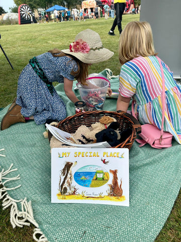children sharing my special place children story illustrated picture book by Gina Rees sitting at a school show on a rug
