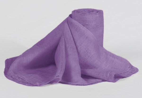 A collection of shawls in lavender color, carefully chosen to complement the overall look of the bridal party, showcasing their ability to match different dress colors and styles, ensuring a cohesive and stylish appearance.