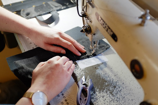 Hands at the sewing machine