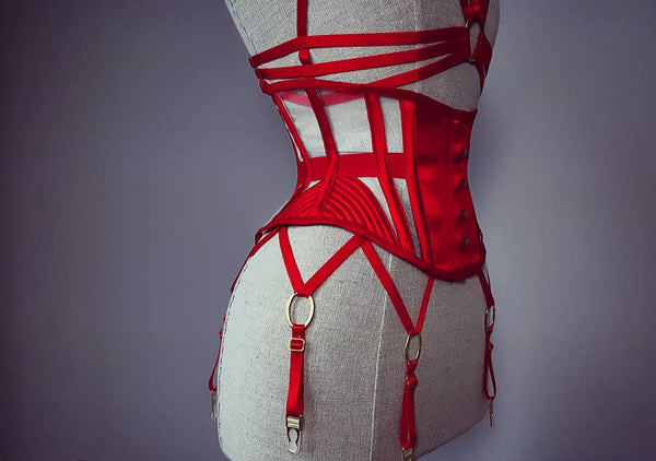 A Seirian waspie in red with matching cage bra