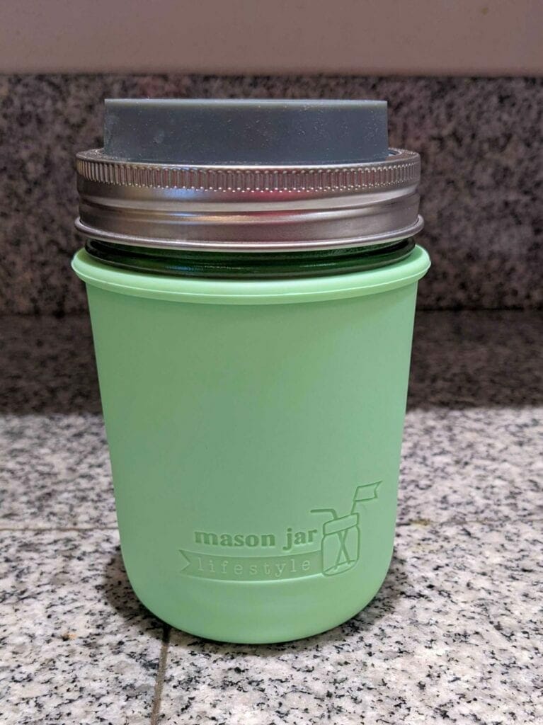 mason-jar-lifestyle-mason-jar-water-bottles-for-any-activity-at-work-on-your-desk-wide-mouth-pint-green-silicone-sleeve-gray-silicone-drinking-lid