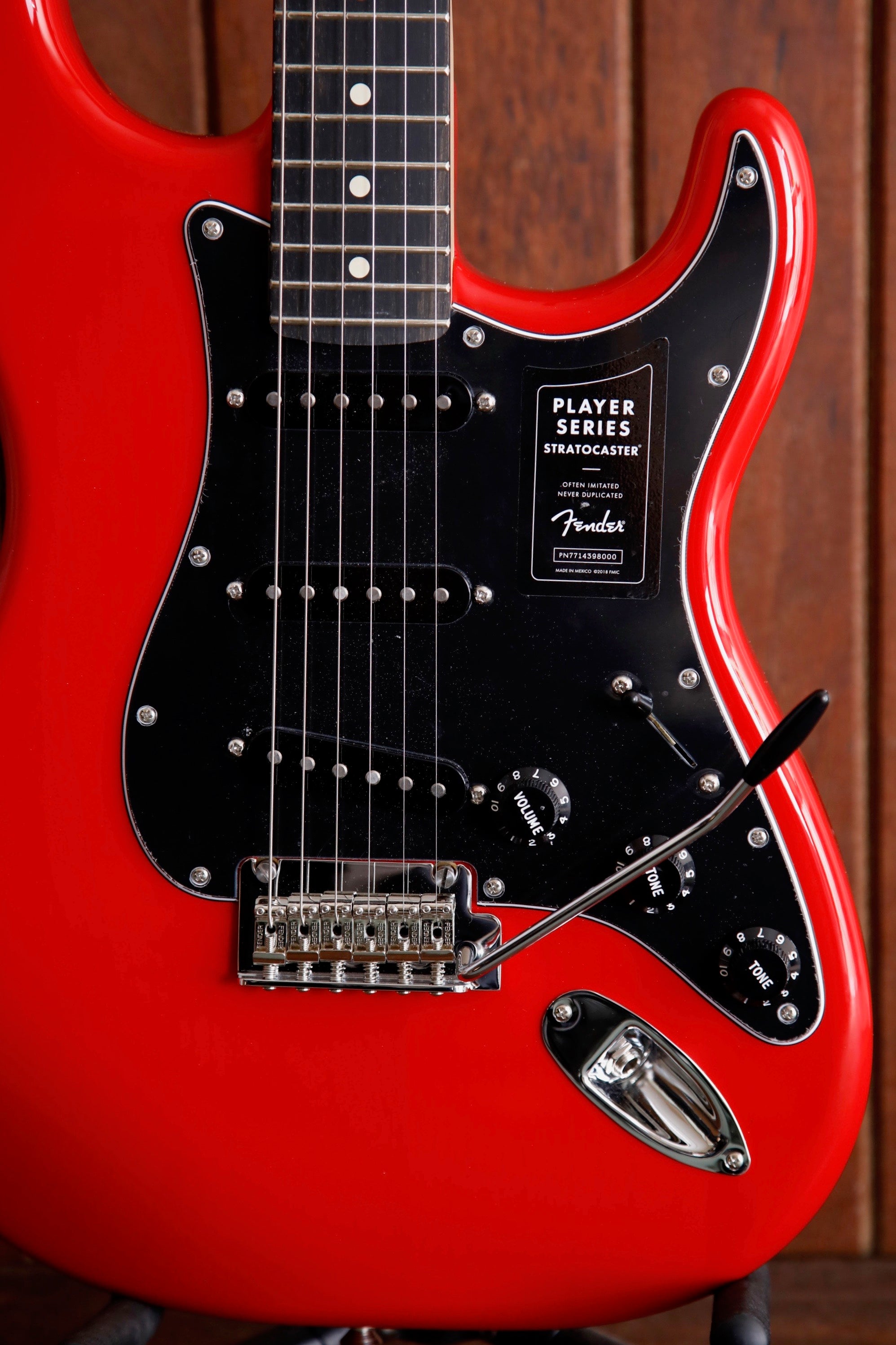 red and black fender guitar