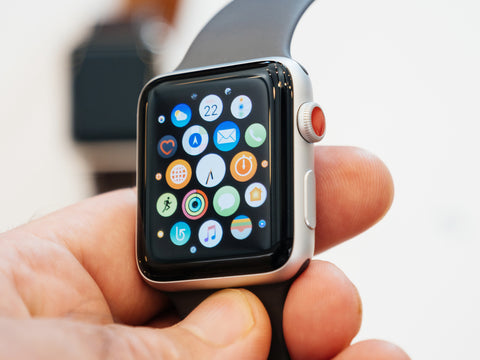 Man holding an apple smart watch