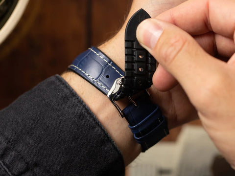 man holding and testing a watch strap