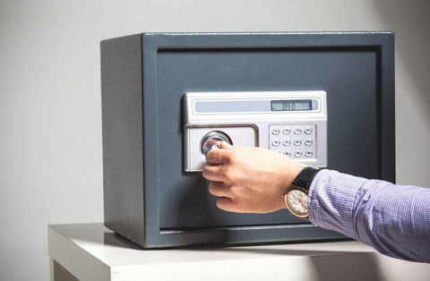 Man opening up a watch hotel safe