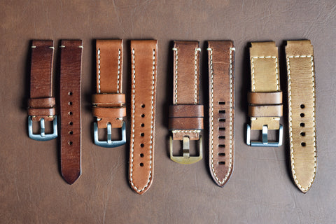 different leather watch bands aligned in a floor