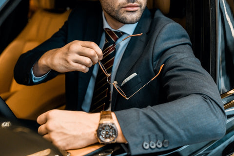 Man wearing a luxury watch while travelling
