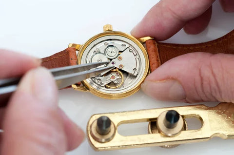 Man opening his mechanical watch