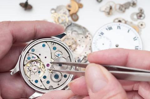 Watchmaker doing professional watch cleaning