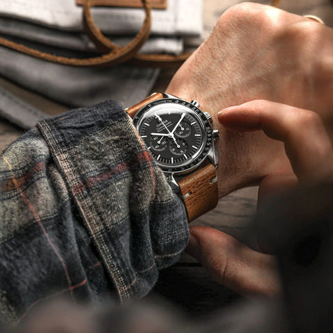 Man wearing a quick release watch strap on an Omega watch