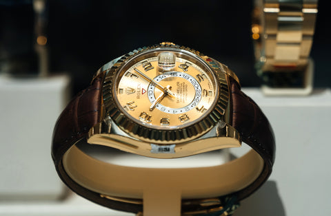 Modern new last collection of luxury gold wrist Swiss watch manufactured by Rolex model Sky Dweller in the official store distributor store showcase in central