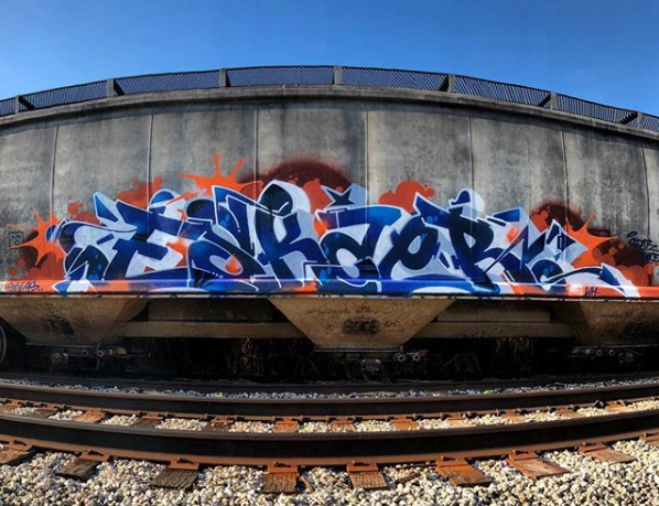 ESKAE545 graffiti piece on freight hopper