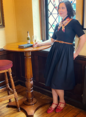 Woman standing in black dress