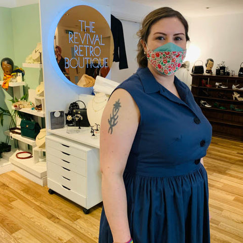 Woman in blue dress and face mask