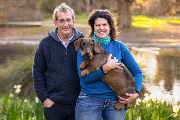 Local pet food entrepreneurs Jeremy and Mary Stewart with Frankie, a wire-haired dachshund.