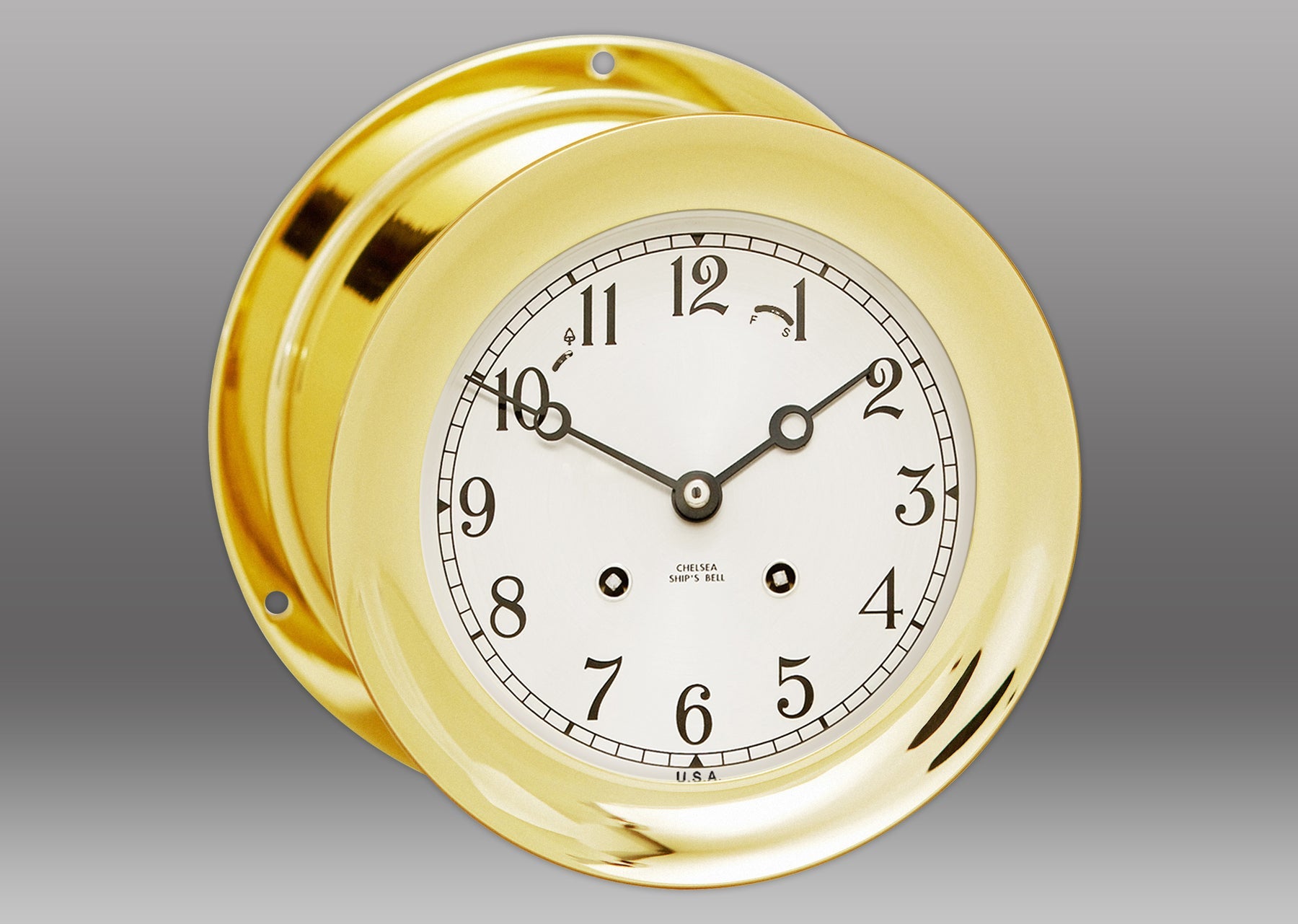 A gold clock with black hands Description automatically generated
