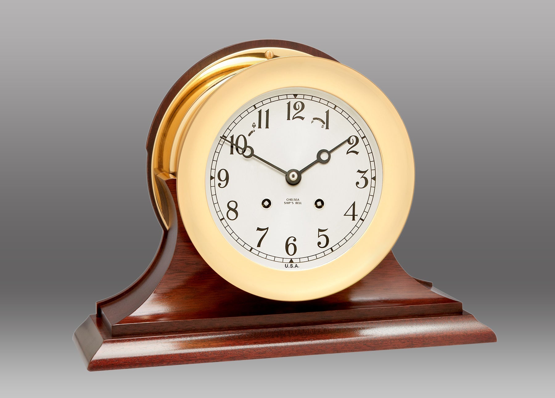 A clock on a stand Description automatically generated