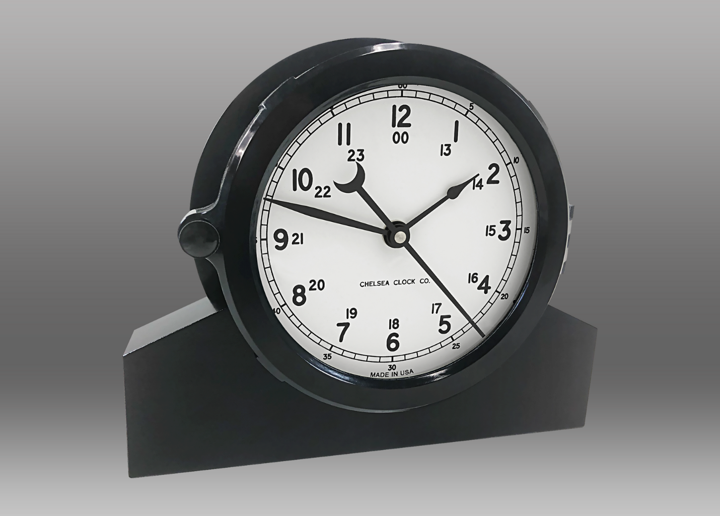 A black and white clock Description automatically generated