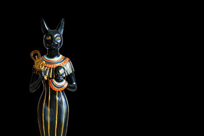an Egyptian statue of a Black cat goddess