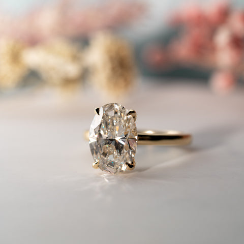 front view of 2.92ct oval lab diamond solitaire in yellow gold