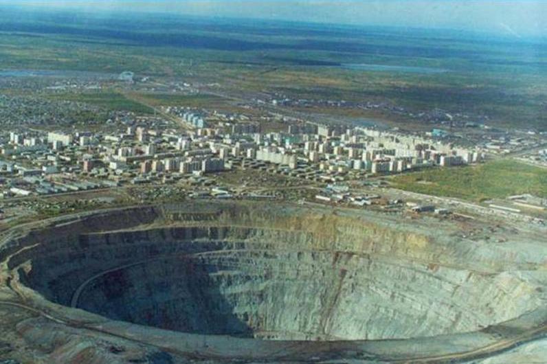 Mir Mine, also called Mirny Mine, is the second largest excavated hole in the world. It is 525 meters (1,722 ft) deep and 1,200 meters (3,900 ft) wide. The hole is so big that even the airspace above the mine was closed to helicopters as there were several incidents of them being sucked in by the downward air flow. SOURCE: Wikipedia