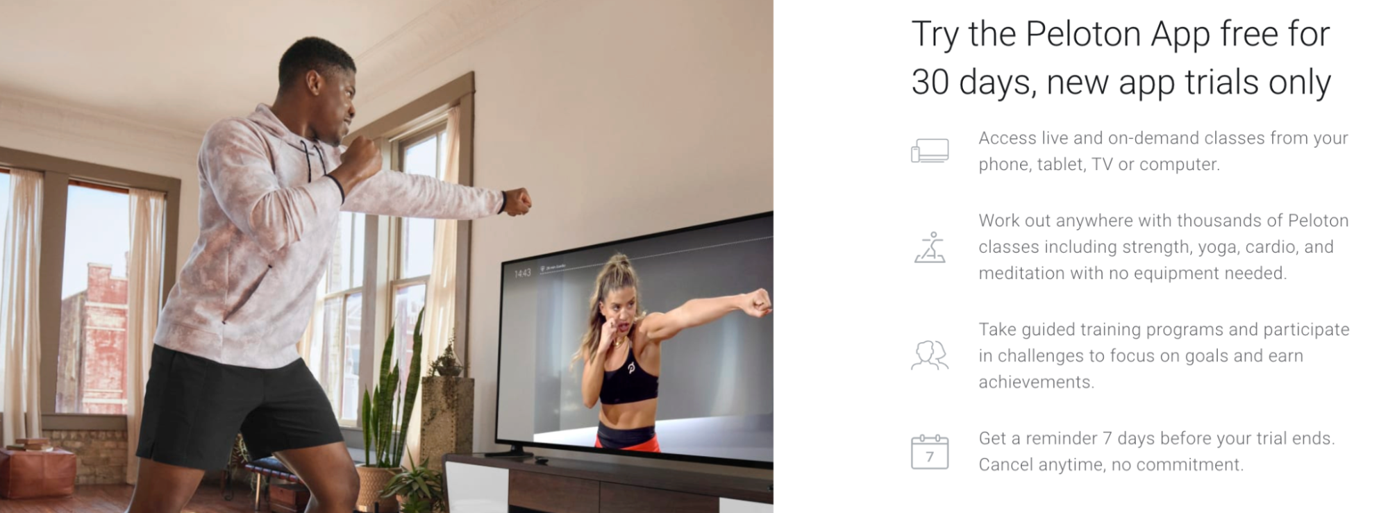 Man doing boxing exercise class at home in front of television screen